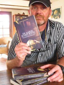 Author with his book about Ecuador, The Earth isn’t round