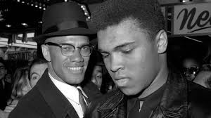 Malcolm X with a young Mohammad Ali. Read about in Branch’s Pillar of Fire. 