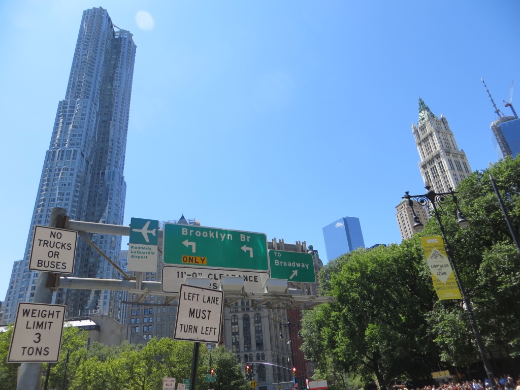 Signs indicating the Brooklyn Bridge, one of first attractions on our visit of Manhattan, New York.