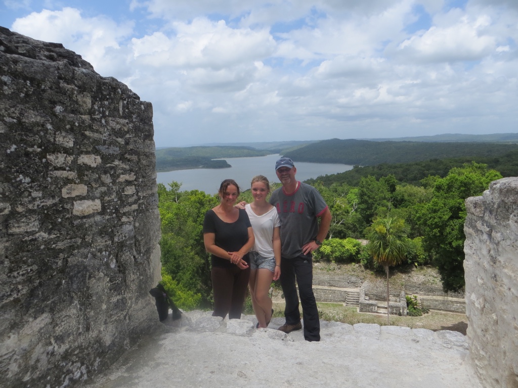 Me, my wife & daughter during our visit to the Maya site Yaxha, Guatemala. Posing on the highest pyramid, with views over the nearby lake Yaxhá.