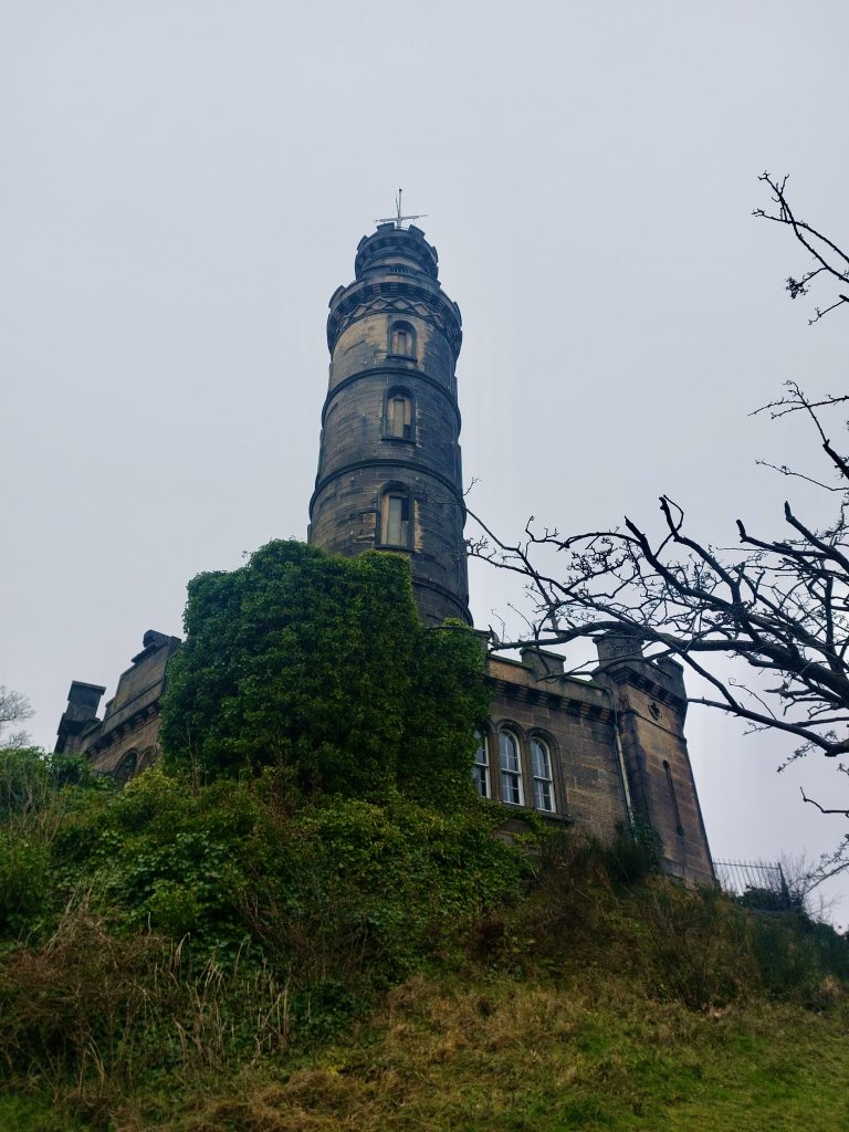 The Nelson Monument on the top of Calton Hill, looking like an upside down telescope.