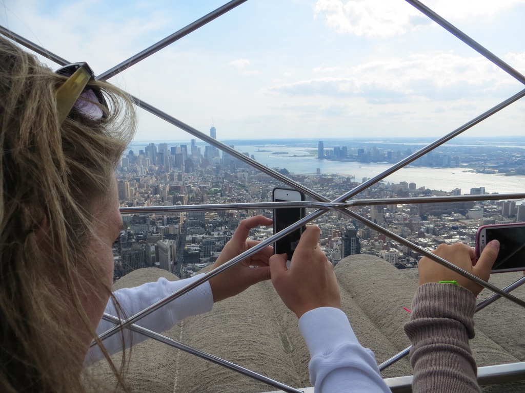Taking pictures of Manhattan from the Empire State Building.