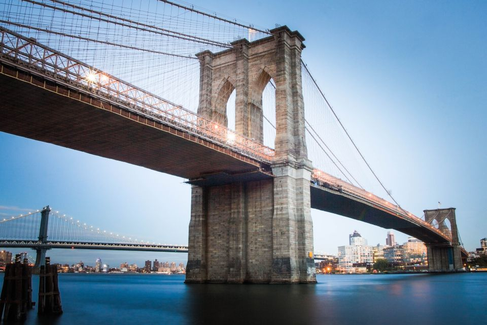 The Brooklyn Bridge, seen from below (the East River's Edge), Manhattan, New York.