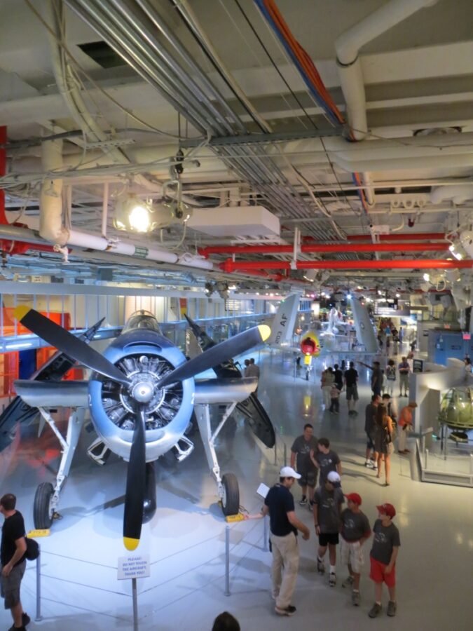Small combat planes with foldables wings below deck at the Intrepid Sea, Air & Space Museum, Manhattan, New York.