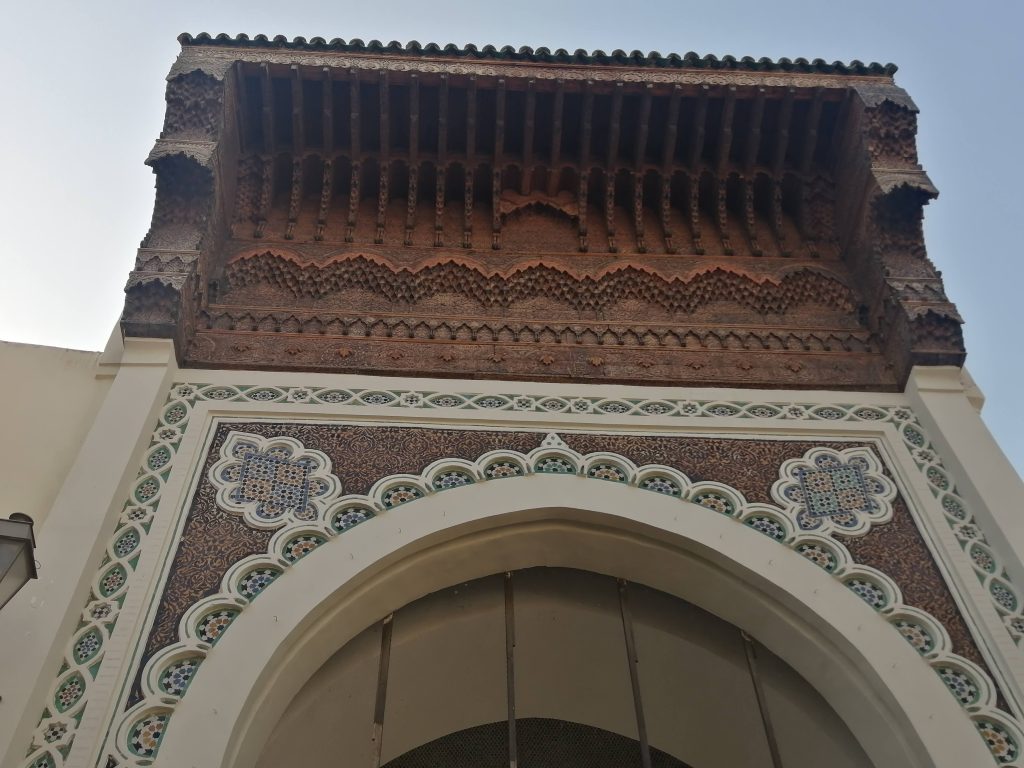 Detail of the facade of Andalusian mosque in Fez. Beautiful tile work & cedar wood carvings.