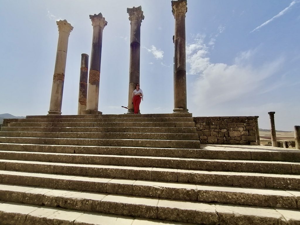 My daughter on top of the stairs of  the main temple of Volubilis, near Fez.