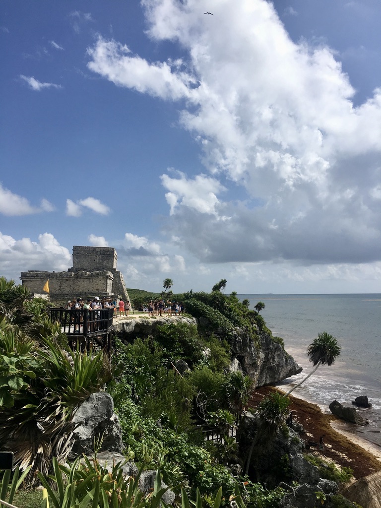 A visit to Tulum. View of the main temple, bordering the Carribean Sea. A place visited by many tourist every day, as you can see on the photo.