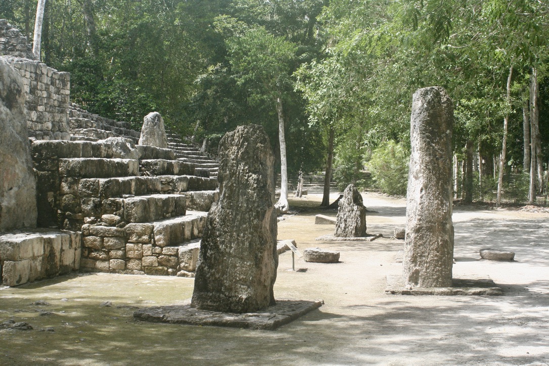 Impression of our visit to Calakmul, part of the lower stair of one of the main temples, and some stelea in front of the temple.