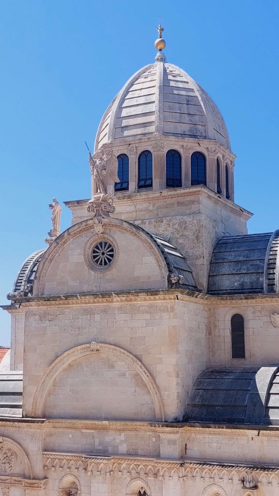 Dome of the St. James Cathedral. In front the Archangel St. Michael, protector of Šibenik