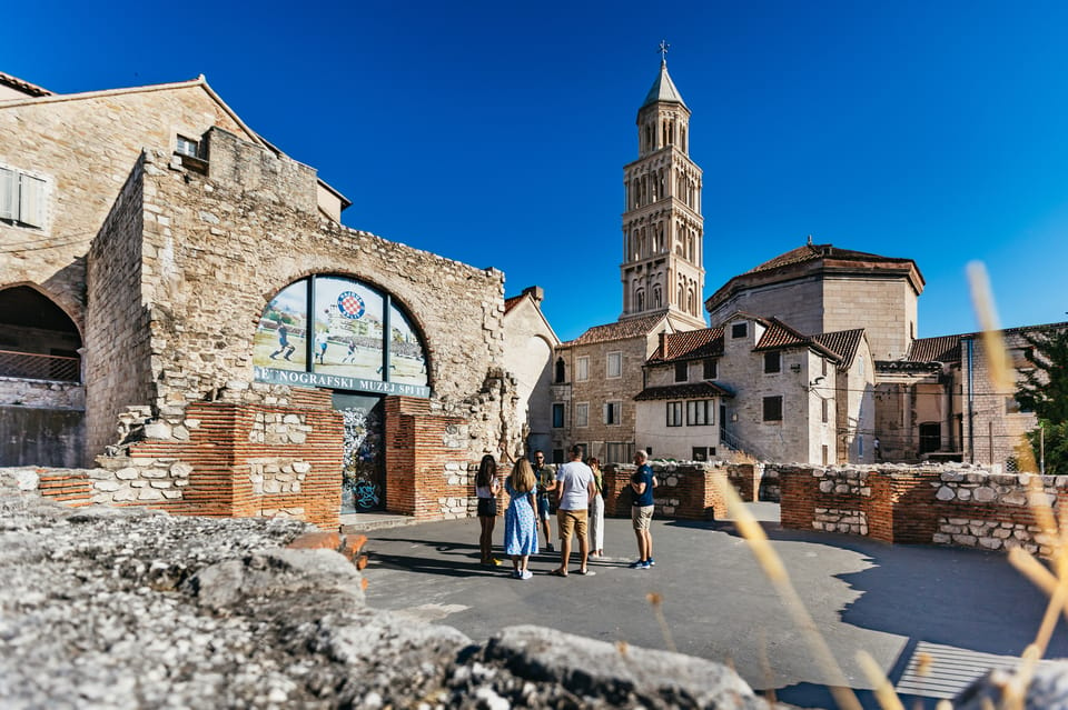 A small group chose for a walking tour on their visit to Split. In the background The Saint Domnius Bell Tower standing proud above the historical city center of Split. 