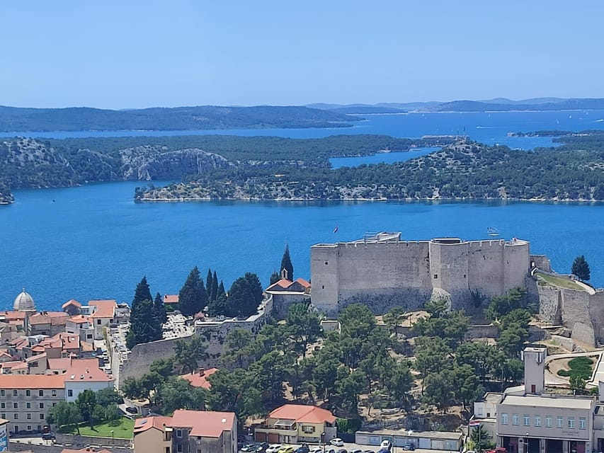 View of a part of Sibenik's inner city  with the medieval St. Michael's fortress still standing protectively on its coastline. In the background to the left the St. Anthony Canal.