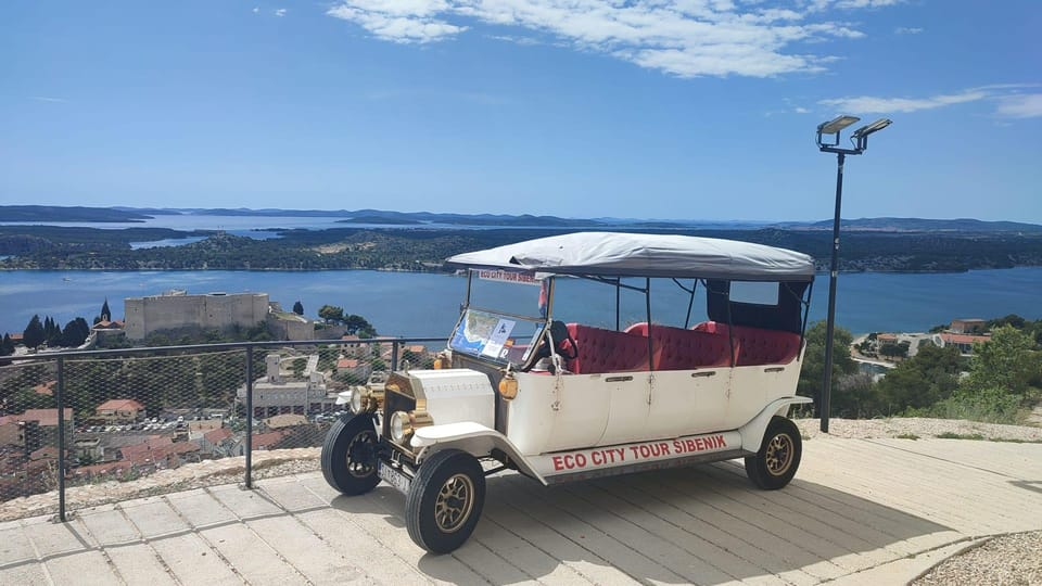 View of Šibenik & surrounding area from St' John's Fortress. In the front the old timer type vehicle used by Eco City Tour Šibenik to visit the Fortresses. 