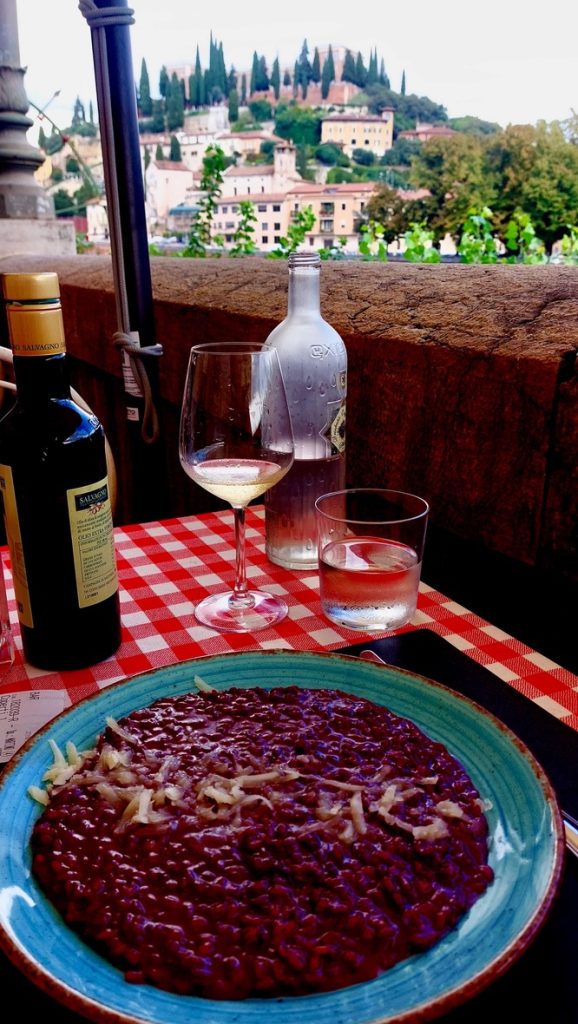 A personal favorite when in Verona, Risotto all'Amarone, with a white wine & a fascinating view of the city center.