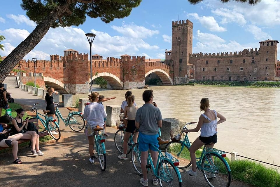 Impression of the Bike Tour along Verona's Hidden Gems. In the background the Castelvecchio caste & bridge.