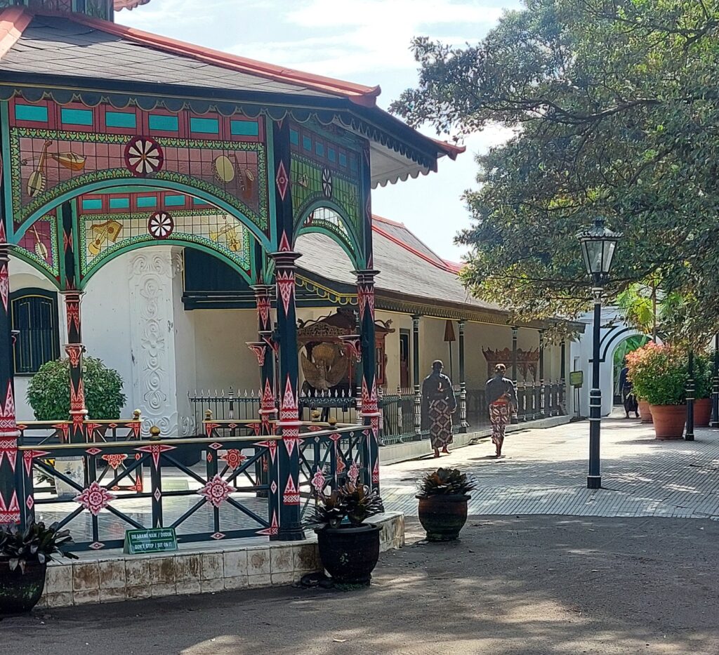 One of the inner courtyards of the Kraton in Yogyakarta with two servants.